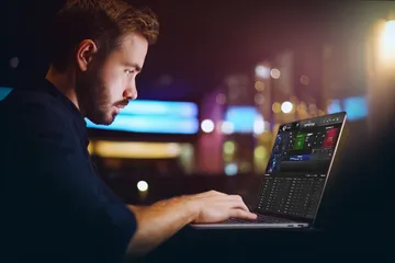 A cheerful woman in traditional clothing using her smartphone during a festive moment, showing how easily the BDJL1 app fits into everyday life.